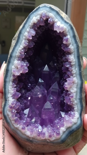 Radiant cluster of purple amethyst crystals in geode photo