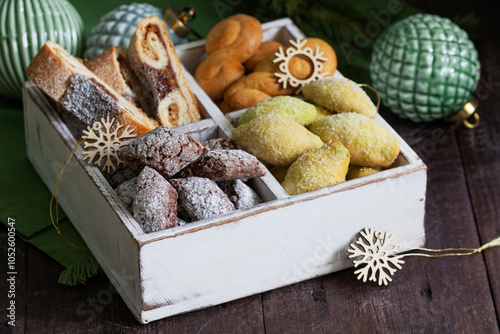 Obraz na płótnie Assorted Christmas cookies with different fillings, Christmas decorations on a wooden background. Rustic style. w salonie