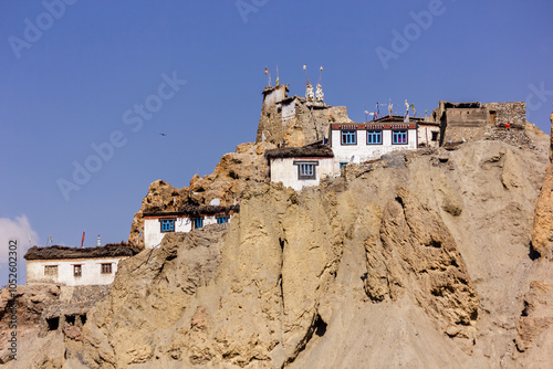 Ancient monastery built on a cliff photo