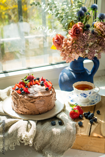 Cozy moment with chocolate cake photo