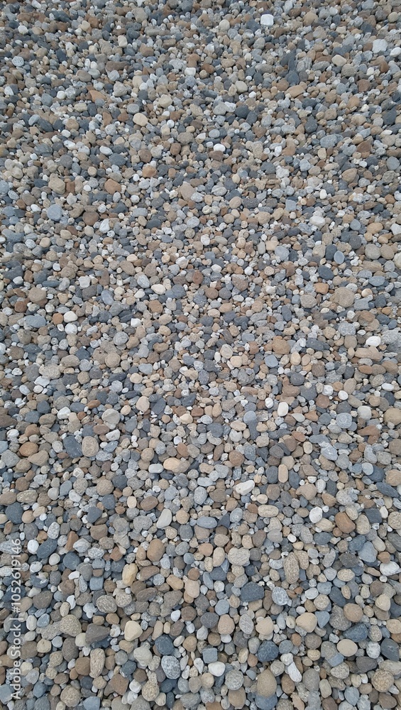 Tranquil pebble strewn path with gray white and brown stones tightly packed Tranquil pebble strewn path with gray white and brown stones tightly packed