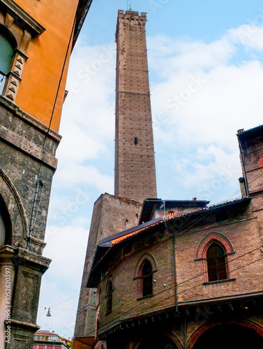 The tall Lianing Tower of Bologna and buildings of Middle Ages, Italy photo