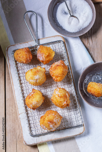 Obraz na płótnie Curd donuts with sugar served with tea or coffee on a light wooden background. Rustic style. w salonie