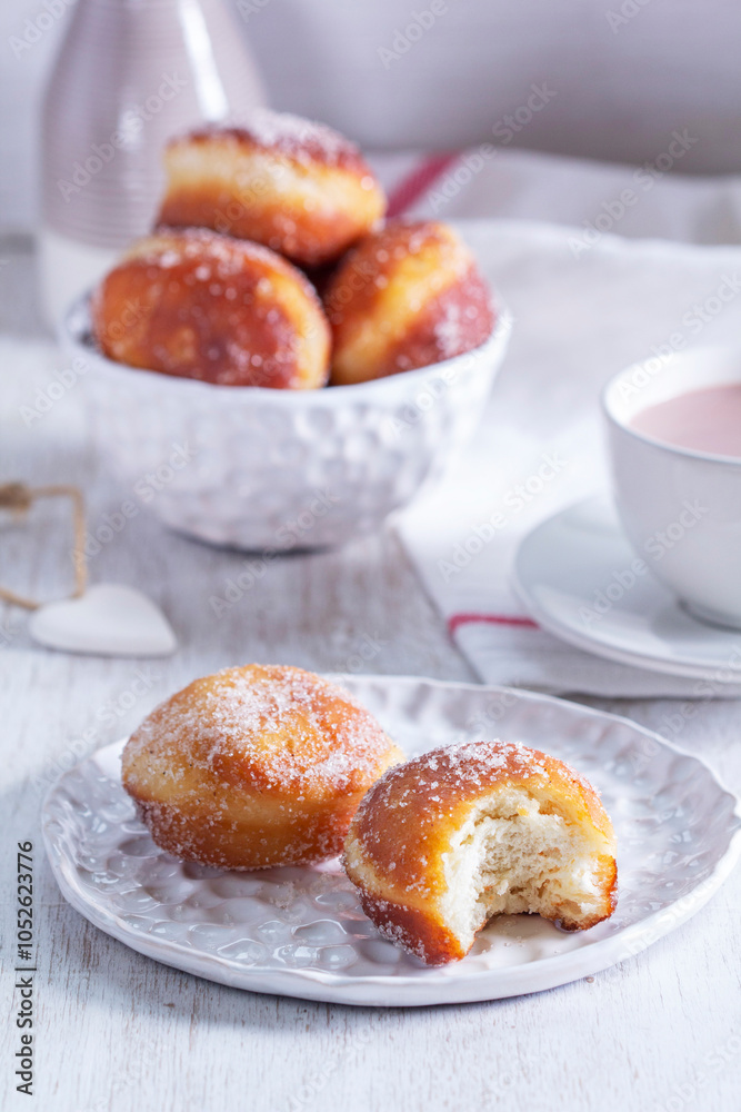 Donuts with sugar and cinnamon served with cocoa. Traditional dessert for Carnival.