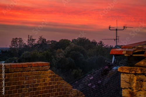 Old buildings in autumn sunset red evening in Opocno town photo