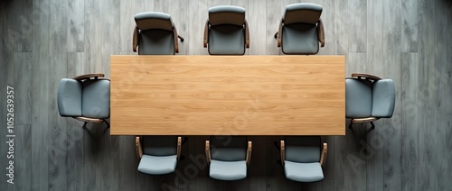 top view of the interior of an office meeting room with wooden table and chairs in a row. Meeting room