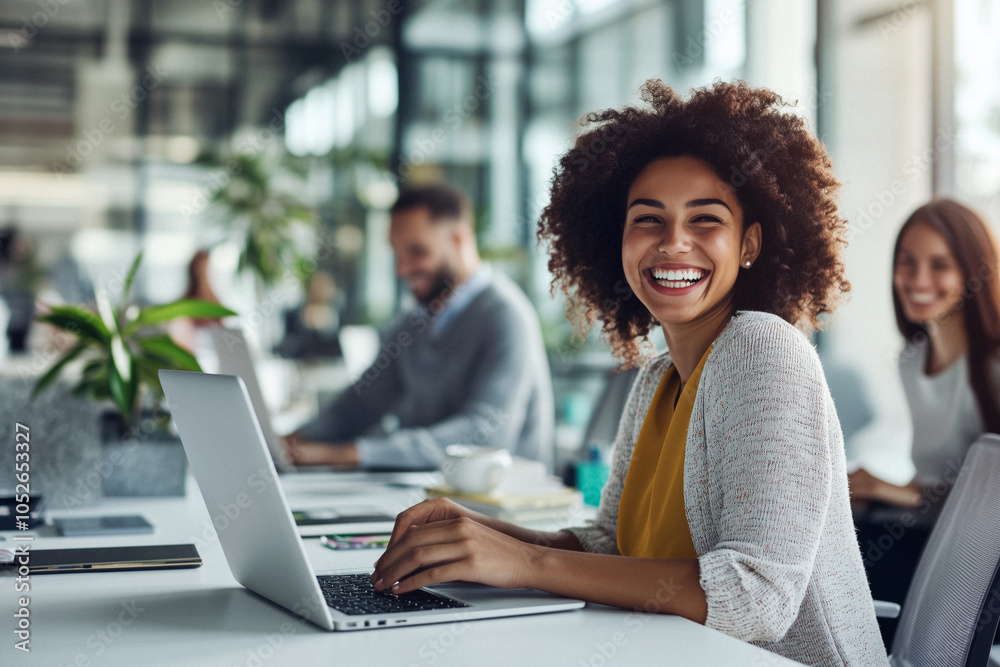 Happy Woman Smiling at Work in a Modern Office Setting Happy Woman Smiling at Work in a Modern Office Setting