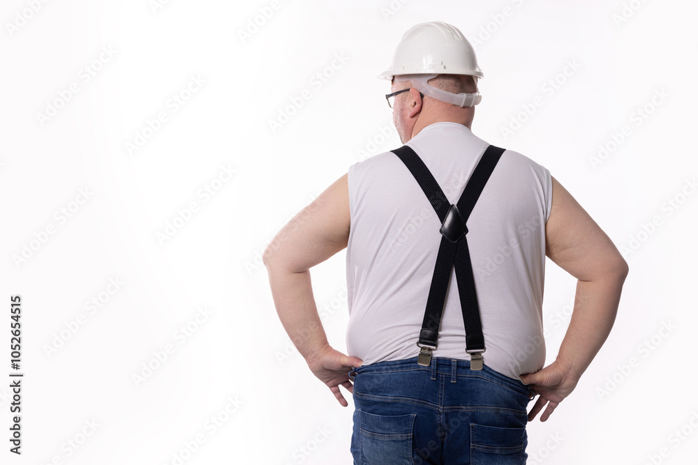 A dedicated Construction Worker, clad in complete Safety Gear, ready to begin his task A dedicated Construction Worker, clad in complete Safety Gear, ready to begin his task