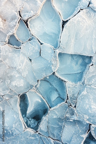Ice formations creating patterns on a frozen lake during winter