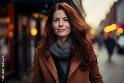 Portrait of a beautiful young woman in a coat and scarf.