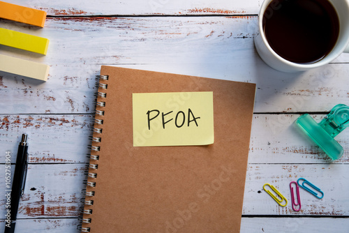 There is sticky note with the word PFOA. It is an abbreviation for Per Fluoro Octanoic Acid as eye-catching image. photo