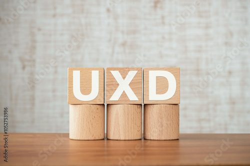 There is wood cube with the word UXD. It is an abbreviation for User eXperience Design as eye-catching image. photo