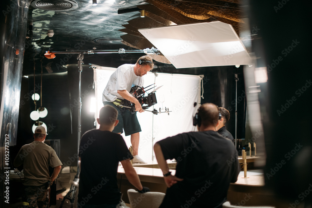 Film set, monitors and modern shooting equipment. Film crew, lighting devices, monitors, playbacks - filming equipment and a team of specialists in filming movies, advertising and TV series Film set, monitors and modern shooting equipment. Film crew, lighting devices, monitors, playbacks - filming equipment and a team of specialists in filming movies, advertising and TV series
