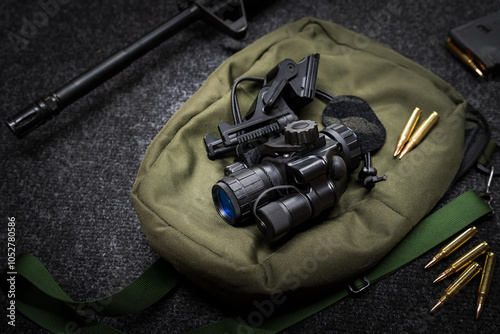 Military night vision monocular with helmet mount.