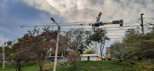 A large crane towers over the construction site. Urbanization.
Construction sites everywhere are building up the coast of Odessa, thereby destroying the public and park area. photo