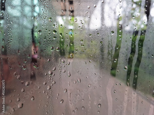 Принти на полотні Blurred image of water drops clinging to the glass