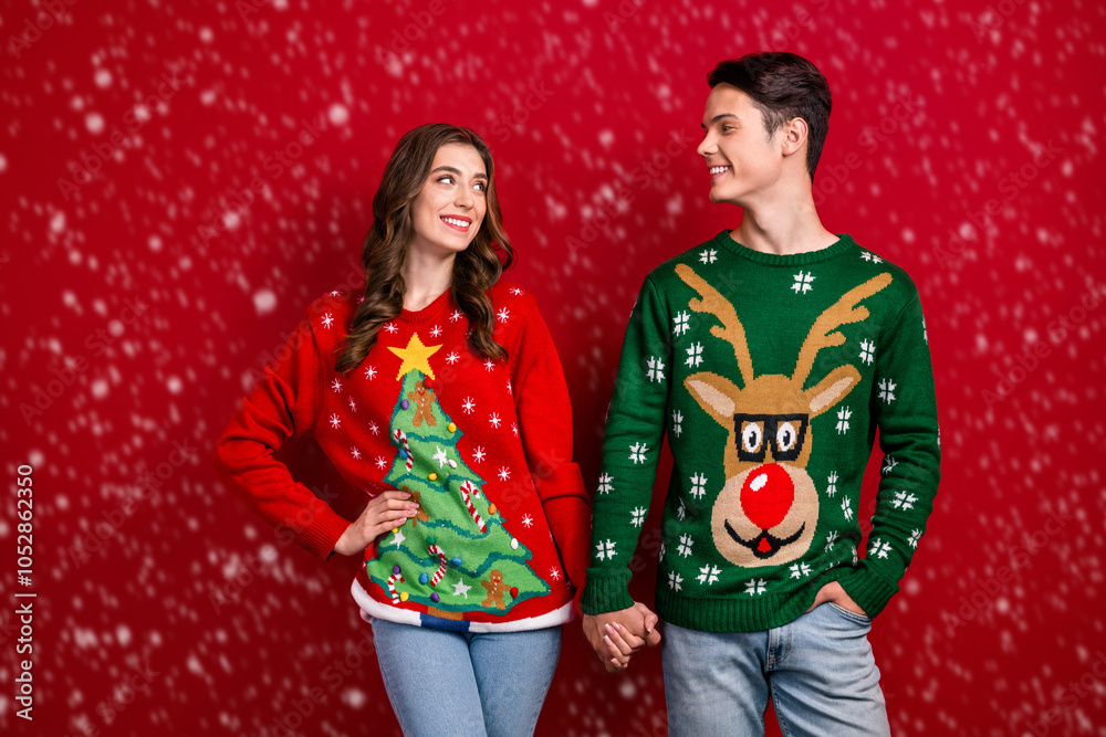 Photo of lovely sweet couple husband wife hands hold look each other enjoy romance magic date midnight isolated on red color background Photo of lovely sweet couple husband wife hands hold look each other enjoy romance magic date midnight isolated on red color background