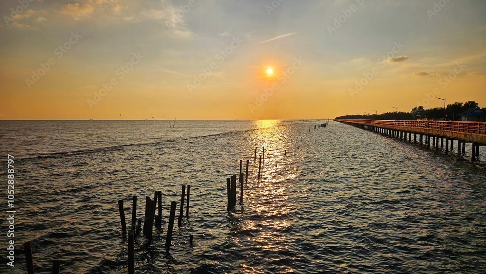 Sunset view at sea shore with red bridge walk way landscape, Thailand. Sunset view at sea shore with red bridge walk way landscape, Thailand.