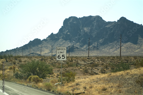 SPEED LIMIT 65  Signboard Mountain View Background photo