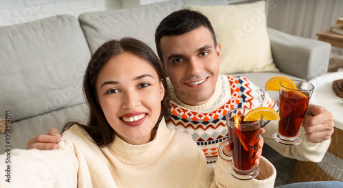 Happy couple with glasses o...