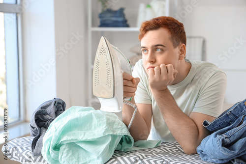 Bored young man with electr...
