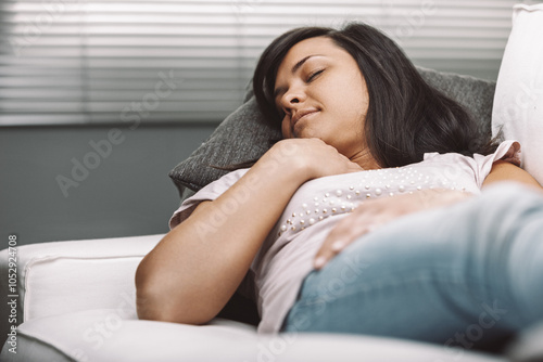 Free Download Serene woman resting peacefully on comfortable sofa - GFXLoad