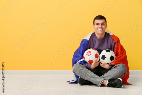 Young man with soccer balls...