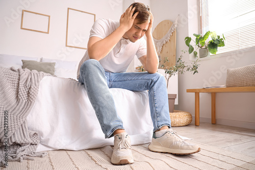 Young man suffering from he...