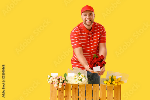 Young man selling flowers o...