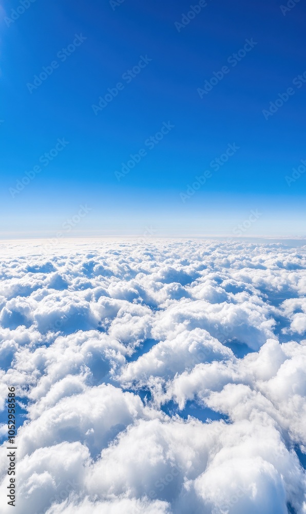 Naklejka premium Breathtaking Aerial View of Fluffy Clouds Against a Blue Sky