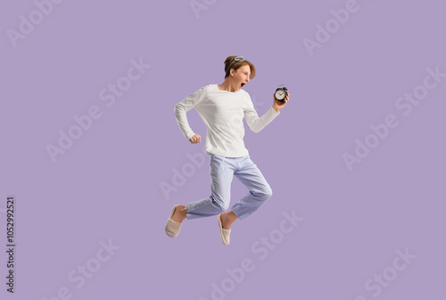 Shocked young man in pajama...
