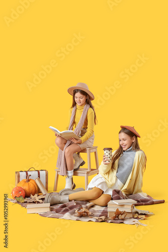 Cute girls in autumn clothe...