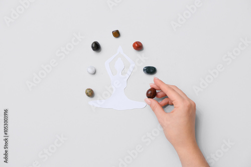 Woman with set of chakra st...
