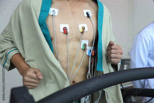 Wallpaper Mural Heart electrocardiogram or monitoring using Holter for young patient. Male athlete does a cardiac stress test. wearing Holter monitor device for daily monitoring of an electrocardiogram. Torontodigital.ca
