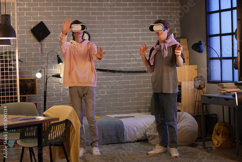Male students using VR glas...