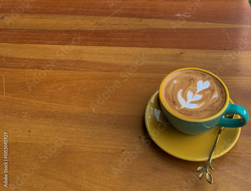 hot cappuccino in yellow cup