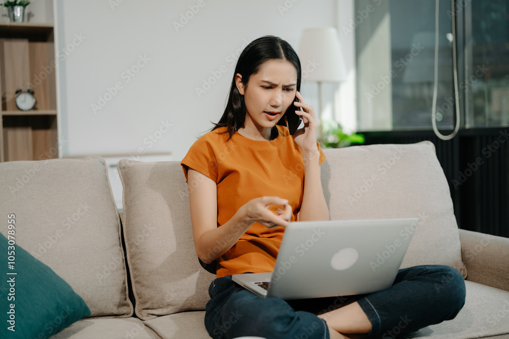 Female manager attending video conference and holding tablet, smatrphone and cup of coffee on sofa at home Female manager attending video conference and holding tablet, smatrphone and cup of coffee on sofa at home