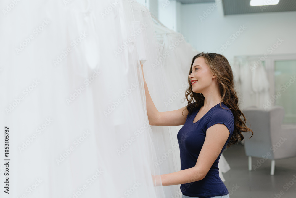 young beautiful caucasian brunette girl choosing wedding dress in bridal salon, preparing to wedding, choose wedding dress concept, copy space young beautiful caucasian brunette girl choosing wedding dress in bridal salon, preparing to wedding, choose wedding dress concept, copy space