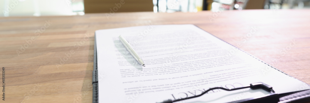 Fototapeta premium Contract documents and pen lie on table in business office