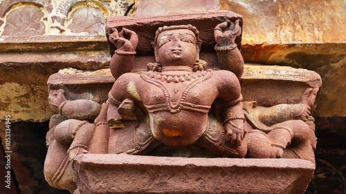 Intricate carved sculpture of Kichak on the Jain Temple walls, located in Budhi Chanderi, Madhya Pradesh, India. photo