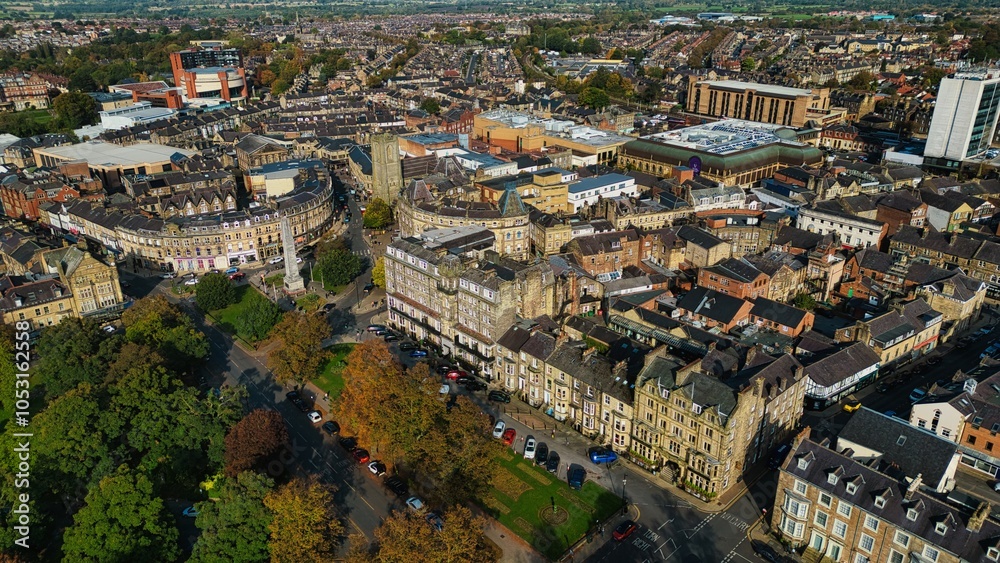 Fototapeta premium Aerial View of a Vibrant Town with Historic and Modern Architecture
