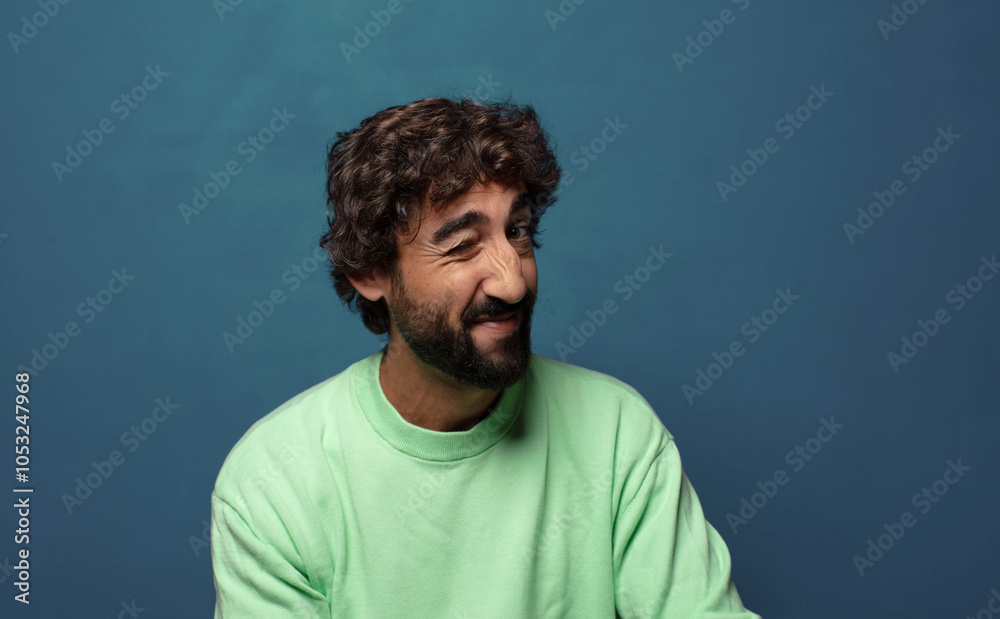 looking happy and friendly, smiling and winking an eye at you with a positive attitude looking happy and friendly, smiling and winking an eye at you with a positive attitude