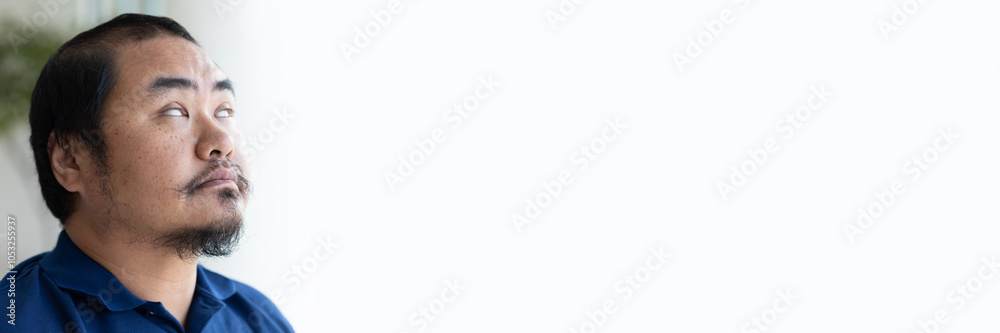 Obraz premium Blind, visual-impaired middle aged asian man, concept image for blindness, visual impairment, vision loss, people with disability, handicap accessibility