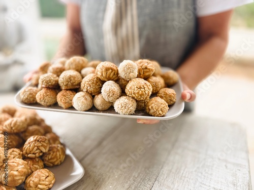 Panellets on the tray freshly baked.
 photo