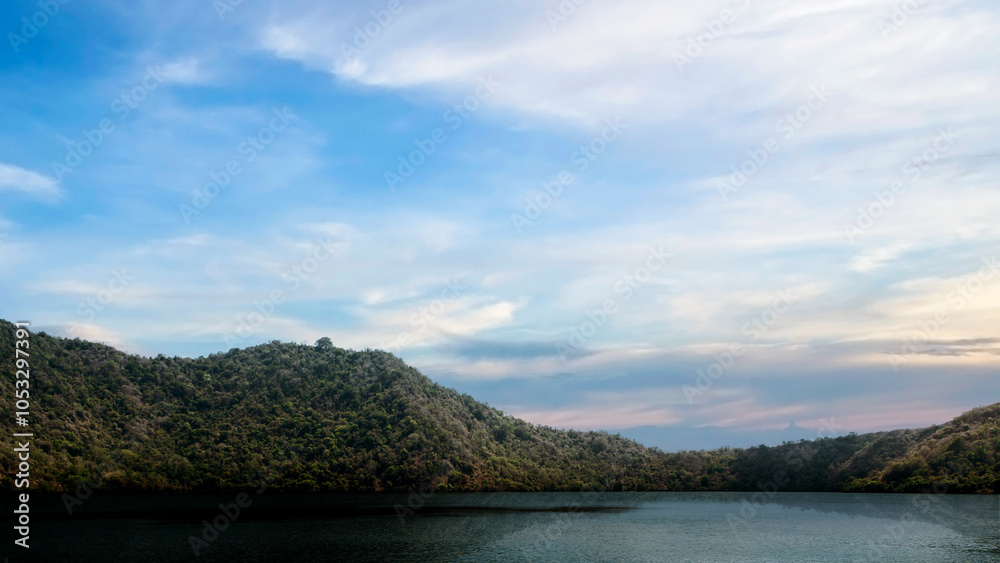 Fototapeta premium Lakes with hills with blue sky and clouds in the background