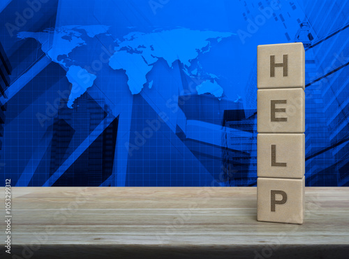 Fototapeta Naklejka Na Ścianę i Meble -  HELP letter on wood block cubes on wooden table over world map, modern office city tower and skyscraper, Business customer service and support concept, Elements of this image furnished by NASA