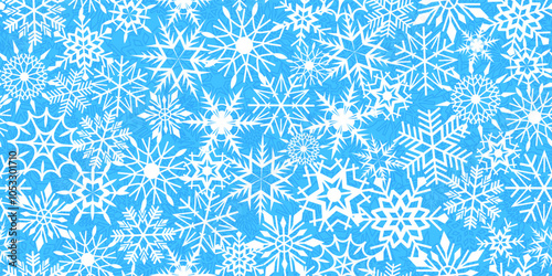 Abstract seamless background with different snowflakes in blue and white. Stock vector illustration for textile or wrapping paper.