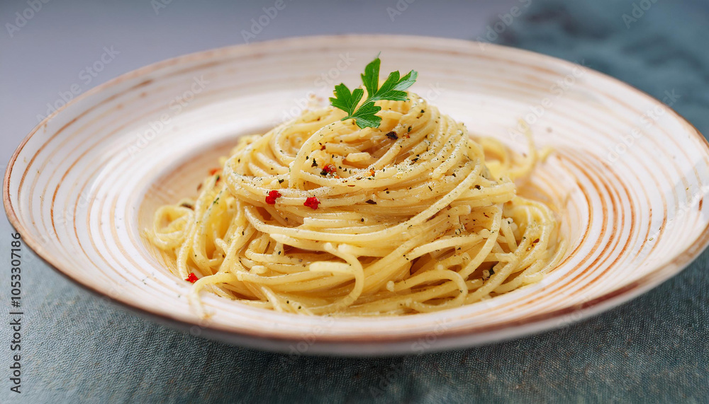Close-up of spaghetti aglio e olio with sauteed garlic, chili flakes, parsley. Tasty Italian food.