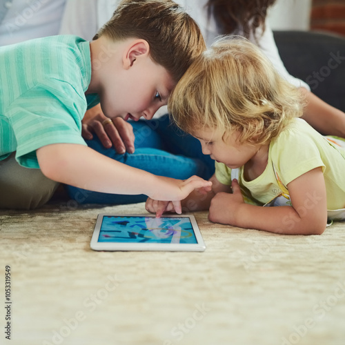 Floor, playing and children with tablet in home for watching movies, educational games and online app. Family, screen and young girl and boy on digital tech for internet, cartoons and fun together photo