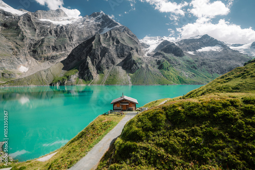 Obraz na płótnie Beautiful alpine mountain scenery with traditional wooden mountain hut at Mooserboden high-mountain water reservoir lakes in Nationalpak Hohe Tauern, Salzburg Land, Austria w salonie